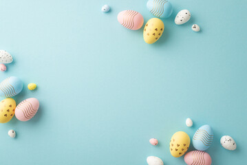 Wall Mural - easter decor concept. top view photo of composition of pink blue and yellow easter eggs on isolated 