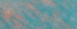 Texture of a light blue felt background with coral spots of fabric, macro. Structure of woolen turquoise textile