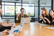 © kanpisut - Diverse colleagues gather in brainstorm discuss statistics together. Group of people colleagues gather doing Brainstorming business plan together. Team Brainstorm Working Concept.