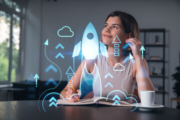 Smiling woman in casual wear taking notes in notebook at office workplace with coffee cup. Concept of distant business education, information technology, dreaming, thinking. Start up drawings