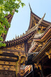 Traditional Chinese architecture details against clear blue sky in BaoLunSi temple Chongqing, China