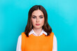 Photo of serious optimistic good mood woman with bob hairstyle dressed orange waistcoat standing isolated on teal color background