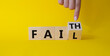 © Natallia - Faith vs Fail symbol. Businessman hand points at turned wooden cube with words Fail and Faith. Beautiful yellow background. Business and Faith vs Fail concept. Copy space