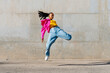 © VISTA by Westend61 - Young dancer hip hop dancing in front of wall