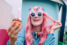 Happy Woman Wearing Novelty Glasses Holding Cupcake Enjoying Birthday