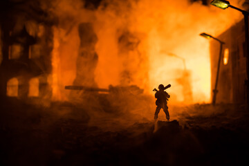 Wall Mural - Military soldier silhouette with bazooka. War Concept. Military silhouettes fighting scene on war fog sky background, Soldier Silhouette aiming to the target at night.