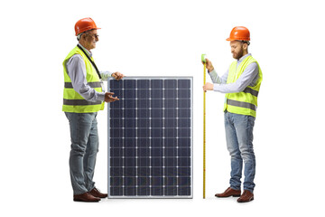 Wall Mural - Male engineers measuring a solar panel