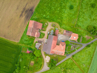 Wall Mural - Aerial view of farm buildings in rural area in Switzerland.