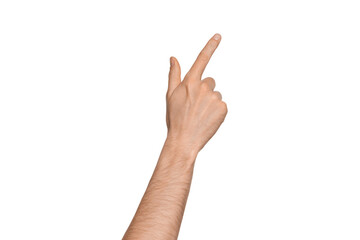a man's hand points the direction with his finger. points diagonally to the side. index finger press