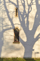 Wall Mural - Beautiful shadow play at the village church in Sievershausen near Lehrte, in Lower Saxony, Germany.