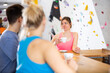 © JackF - Two sports women and a guy communicate after training on a climbing wall at a table in a cafe