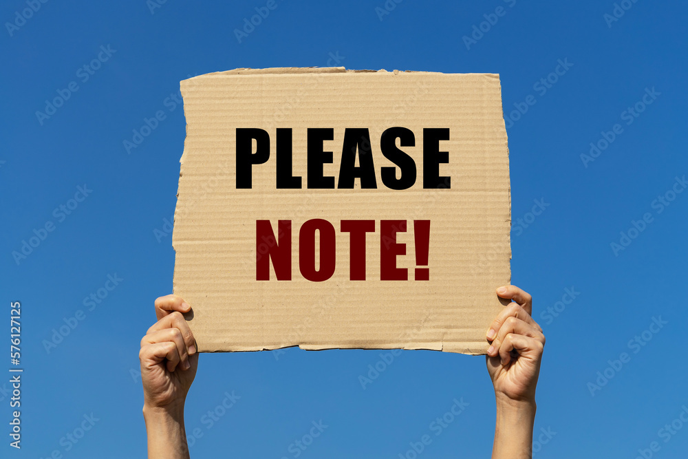 Come To Note Please note text on box paper held by 2 hands with isolated blue sky ...
