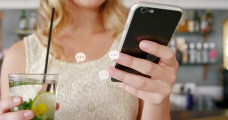 Poster - Animation of message icons floating over mid section of caucasian woman using smartphone at a bar