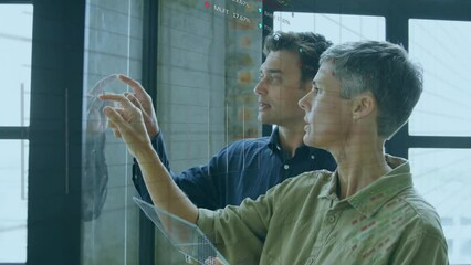 Poster - Animation of data processing over diverse man and woman discussing over glass board at office