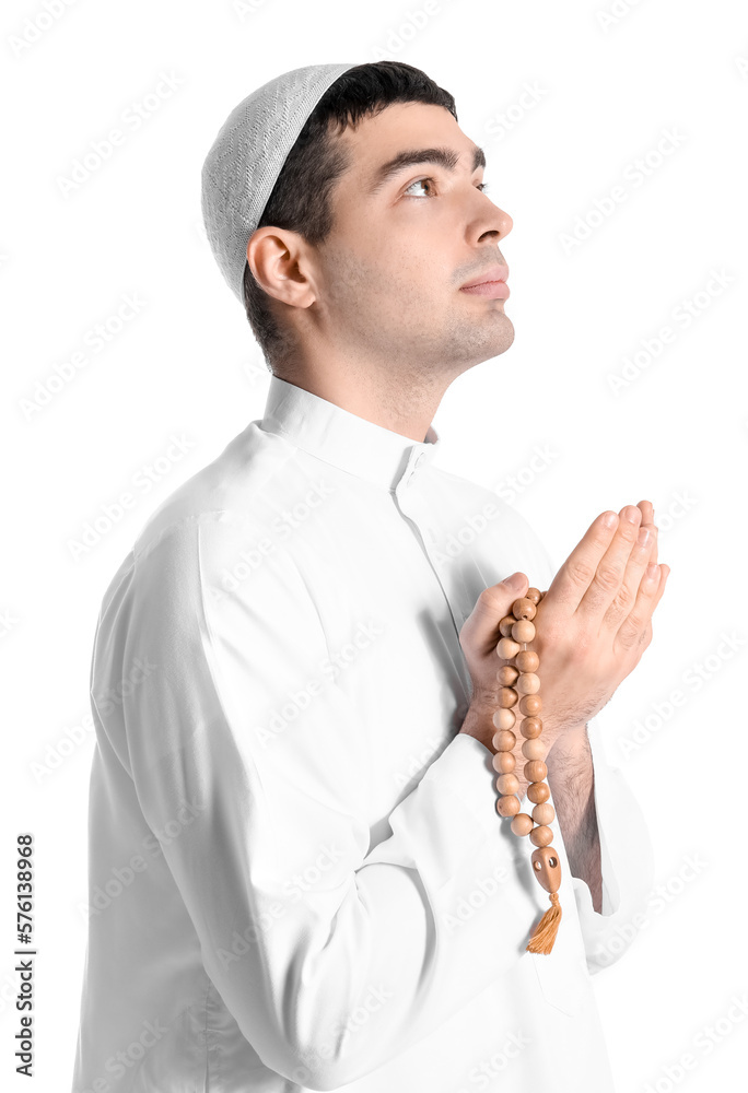 Praying Muslim man on white background