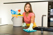 © kues1 - pretty latin woman. housekeeper with clean products.