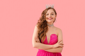 Poster - Young woman in crown and bright prom dress on pink background