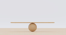 Wooden Spheres Balancing On Seesaw. Concept Of Harmony And Balance In Life And Work