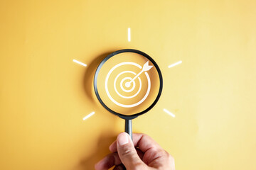 Fototapete - Magnifier glass focus to target objective with idea creative light bulb icon. planning development leadership and customer target group concept...