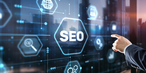 Businessman's fingers pressing a button SEO. Search engine optimization