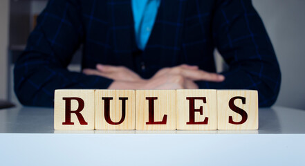 Wall Mural - The word Rules written on wood cube. Business concept