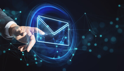 Poster - Online communication and information concept with man finger pushing digital button in form of envelope on virtual touch screen on abstract dark background with blurred dots