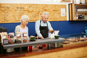 Poster - Support your local bakery. Shot of a senior couple running a small business together.