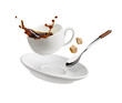 Cup of coffee with a splash drop fly with saucer and spoon on white