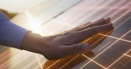 close up on hand of professional maintenance engineer touching industrial solar panel generating ele