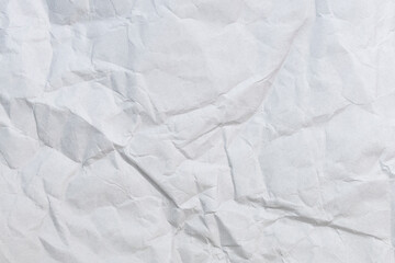 Wall Mural - crumbled paper top view close-up of crumpled sheet of white paper. top view textured paper backgroun