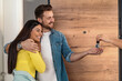 © ivanko80 - Happy  couple taking their new house key from home seller on moving day