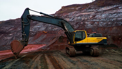 Excavator for the extraction of iron ore in a red iron ore quarry