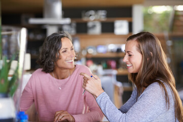 Canvas Print - She definitely inhertid my sense of humor. A mother and daughter bonding in cafe.