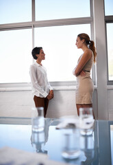 Poster - What do you think of the new proposal. Shot of two businesswomen having a serious discussion.
