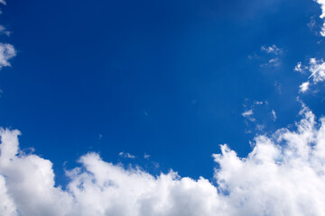 Wall Mural - Blue sky with sunlight and beautiful white clouds.