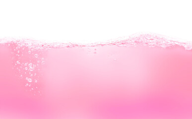 Drink clean pink water in a glass and the bubbles look like splashes and waves.