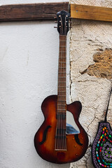 close up of the vintage  guitar on  stone background