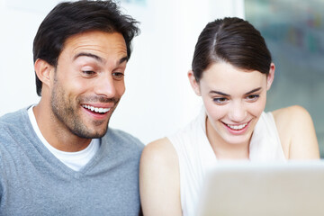 Poster - You learn something new every day. A handsome man and a beautiful young woman working together on a laptop.