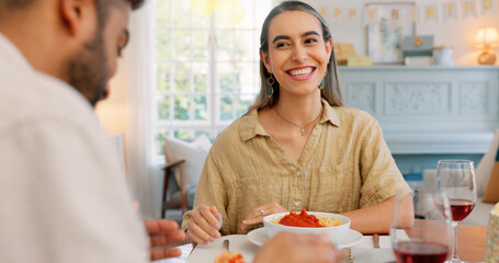 Sticker - Lunch, happy and couple eating pasta together at a dining room table in their house. Happy, relax and calm man feeding a comic woman food during a dinner date in their home for love and peace