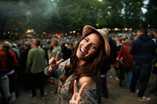 Its All About The Vibe. A Pretty Young Woman Showing A Peace Sign At An Outdoor Music Festival.