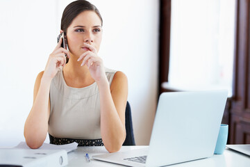 Wall Mural - Let me think about it and get back to you. Shot of a young businesswoman working in an office.