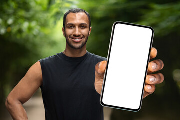 Aufkleber - Fitness Tracker. Sporty Blank Man Holding Big Blank Smartphone While Standing Outdoors