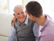 © Mapodile/peopleimages.com - So grateful for his wisdom. Shot of a senior father bonding with his son in their living room.