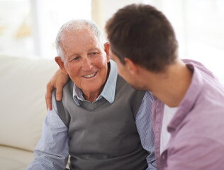 Sticker - So grateful for his wisdom. Shot of a senior father bonding with his son in their living room.