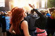 © Mariusz/peopleimages.com - Getting into the show. Rearview shot of a crowd of young people enjoying themselves at an outdoor music festival.