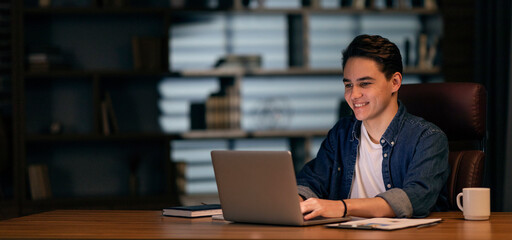 Aufkleber - Positive young guy working on project late at night