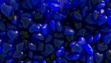 Valentine's Day. A Blue Neon Heart Jumps Out Of A Pile Of Dark Blue Hearts. Heart Shaped Gummies. Sweets.
