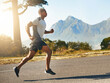 © Donson/peopleimages.com - Wind chaser. Shot of a fit young man going for a run outdoors.
