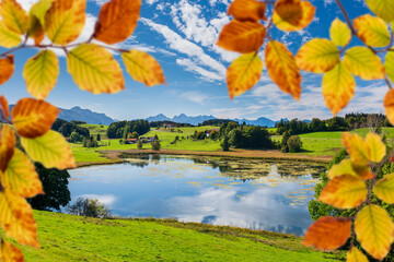 Poster - panoramic view to rural landscape with mountain range and lake at autumn