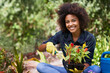 © Mapodile/peopleimages.com - Shes got a green thumb. Portrait of a happy young woman and her tray of plants for the garden.